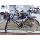 A lady's Raleigh Cameo bicycle, in aubergine coloured livery with straight handlebars,