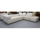 An Italian made stitched white hide upholstered, five person corner settee,