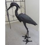 A patinated cast metal garden ornament,