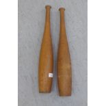 A pair of wooden Indian clubs 21''L RAM