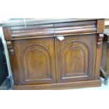 A late Victorian mahogany chiffonier with two frieze drawers, over two arched panelled doors,