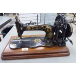 An early 20thC Singer manual sewing machine,