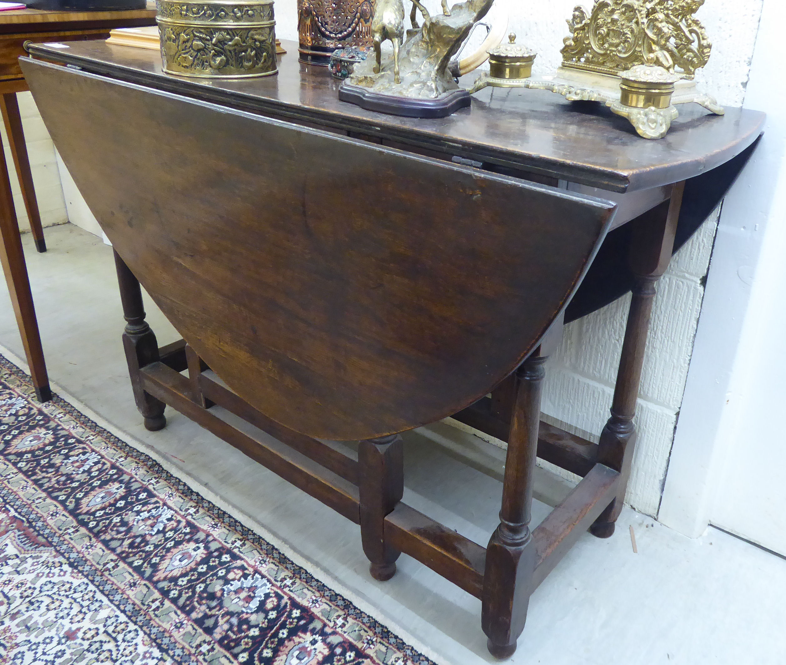 A 19thC country made oak gateleg table with an oval top, - Image 2 of 2