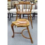 A Stewart Linford burr elm framed captains chair with a spindled back and a solid seat,