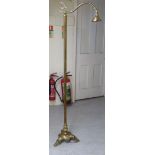 A 20thC lacquered brass standard lamp, raised on a splayed tripod base 64.