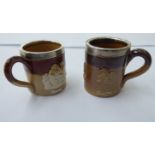 Two similar early 20thC Doulton Lambeth two tone brown glazed stoneware,