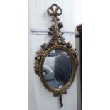 A 20thC reproduction of an 'antique' mirror, the shaped plate,