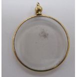 A 9ct gold framed clear plastic set pendant 11