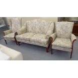 A Parker Knoll floral fabric upholstered cottage suite comprising a two person settee and two