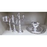 Silver plated tableware: to include a set of three 19thC style, twin branch candelabra,