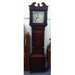 An early 19thC mahogany and oak cased grandfather clock with a swan neck pediment,