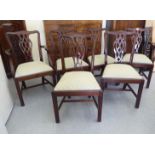 A set of six modern reproductions of mahogany framed Chippendale design splat back dining chairs,