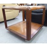 A G-Plan teak coffee table with an inset plate glass top, over an undershelf,