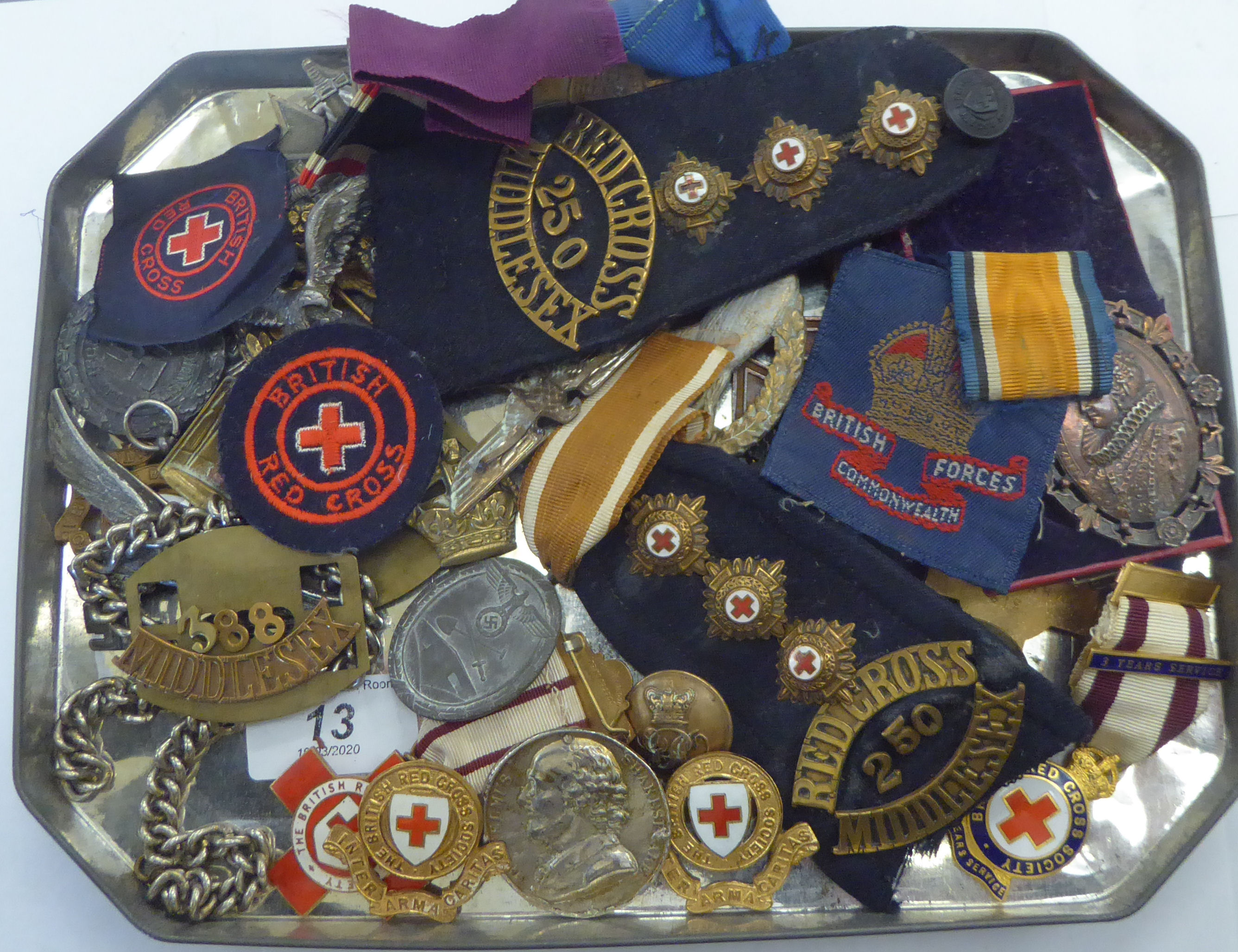 Uncollated German and other military insignia: to include a British Red Cross enamelled badge