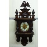 An early/mid 20thC mahogany cased wall clock;