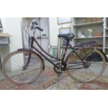 A lady's Raleigh Cameo bicycle, in aubergine coloured livery with straight handlebars,