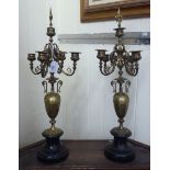 A pair of late Victorian lacquered brass four branch clock sidepieces,