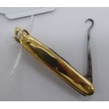 A 9ct gold clad combination pocket knife with a button hook 11