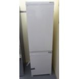 A Blomberg (unused) integrated 60/40 fridge/freezer, in white casing 70''h 21.