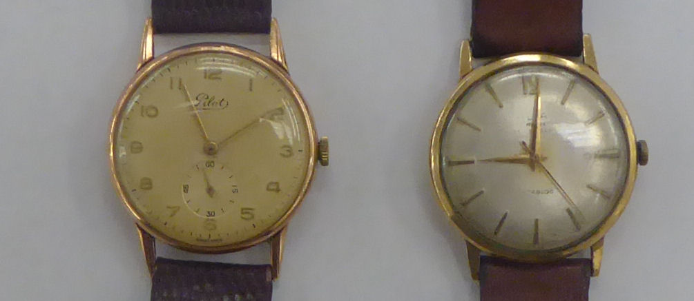 Two gold coloured metal cased wristwatches, faced by Arabic and baton dials,