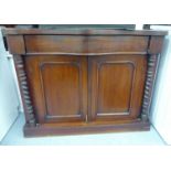 A late 19thC mahogany chiffonier with a serpentine front,