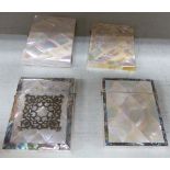 Four late Victorian mother-of-pearl card cases,