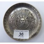 A Chinese white metal dish, set with a central coin 3.