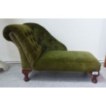 A Victorian style footstool, fashioned as a doll's daybed, button upholstered in a green fabric,