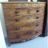 A mid 19thC crossbanded and string inlaid mahogany bow front dressing chest with two short/three