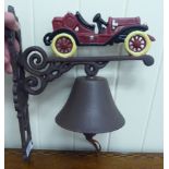 A cast iron bell, on a bracket,