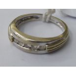A 9ct white gold rubover set,