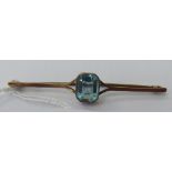 A 9ct gold aquamarine set scarf brooch 11