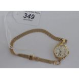 A lady's 9ct gold cased Gleaturn wristwatch, faced by an Arabic dial,