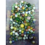A collection of 20thC clear and coloured glass marbles OS1