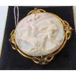 A late Victorian shell carved cameo brooch, depicting a classical scene,