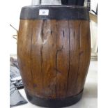 A late 19thC coopered oak spirits barrel with wrought iron mounts, the top impressed HRH,