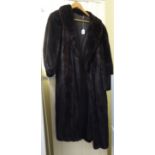 A possibly Blackglama, full-length, black ranch mink coat with cuffs and a collar approx.