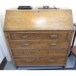 A George III marquetry inlaid oak bureau with a fall flap, over four graduated long drawers,