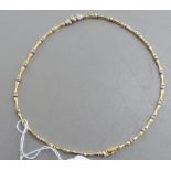 An 18ct bi-coloured gold rod link necklet, set with diamonds,