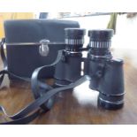 A pair of Tasco 'Zip' 7x - 15x35 zoom binoculars cased BSR