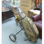 A Cobra golf bag; gentlemens right-handed Dunlop golf clubs; a Dunlop golf trolley;