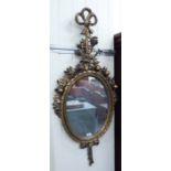 A 20thC reproduction of an 'antique' mirror,