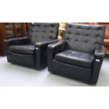 A pair of 1960s/70s part button black faux hide upholstered chairs with level backs, enclosed,