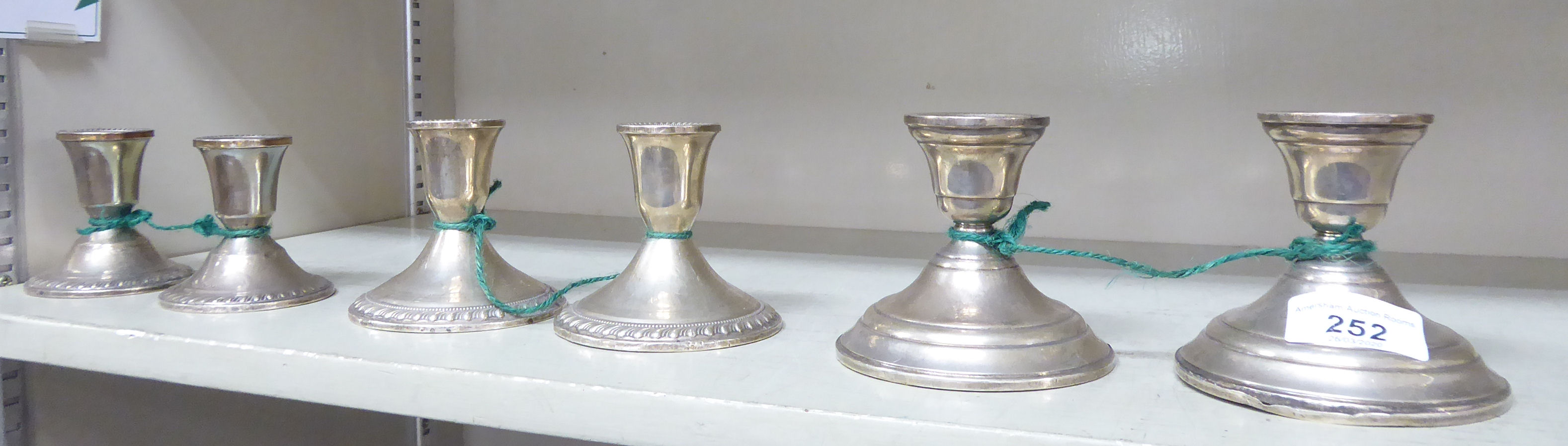 Three pairs of similar Sterling silver dwarf candlesticks 3''-3.