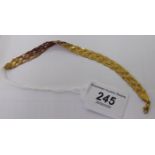 A 9ct gold crossover rope link bracelet 11