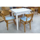 A 1950s melamine finished draw leaf dining table,