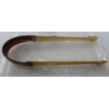 A pair of late Victorian mother-of-pearl and tortoiseshell sugar tongs 11