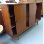 A 'vintage' Roseberry Unit Furniture teak bookcase with sliding doors,
