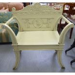 A modern cream painted open arm garden seat, the floral carved,
