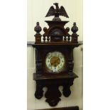 An early/mid 20thC mahogany cased wall clock;